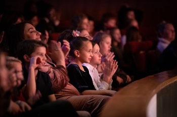 Kid_watching_at_theater_5_x_5_page.jpg